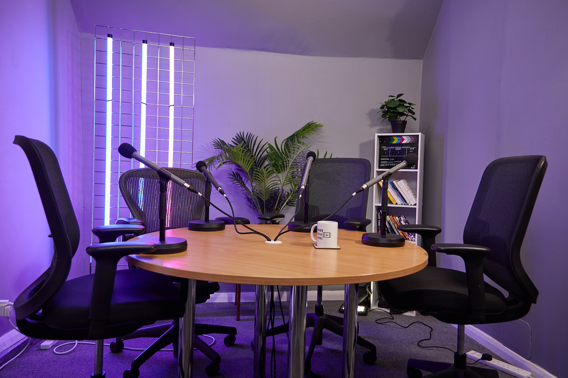 Beginner recording a podcast in a professional London studio at London Media Lounge